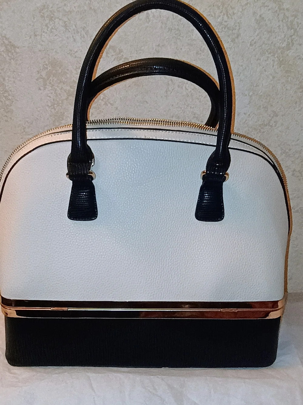 Elegant Two-Tone Black and Cream Dome Satchel